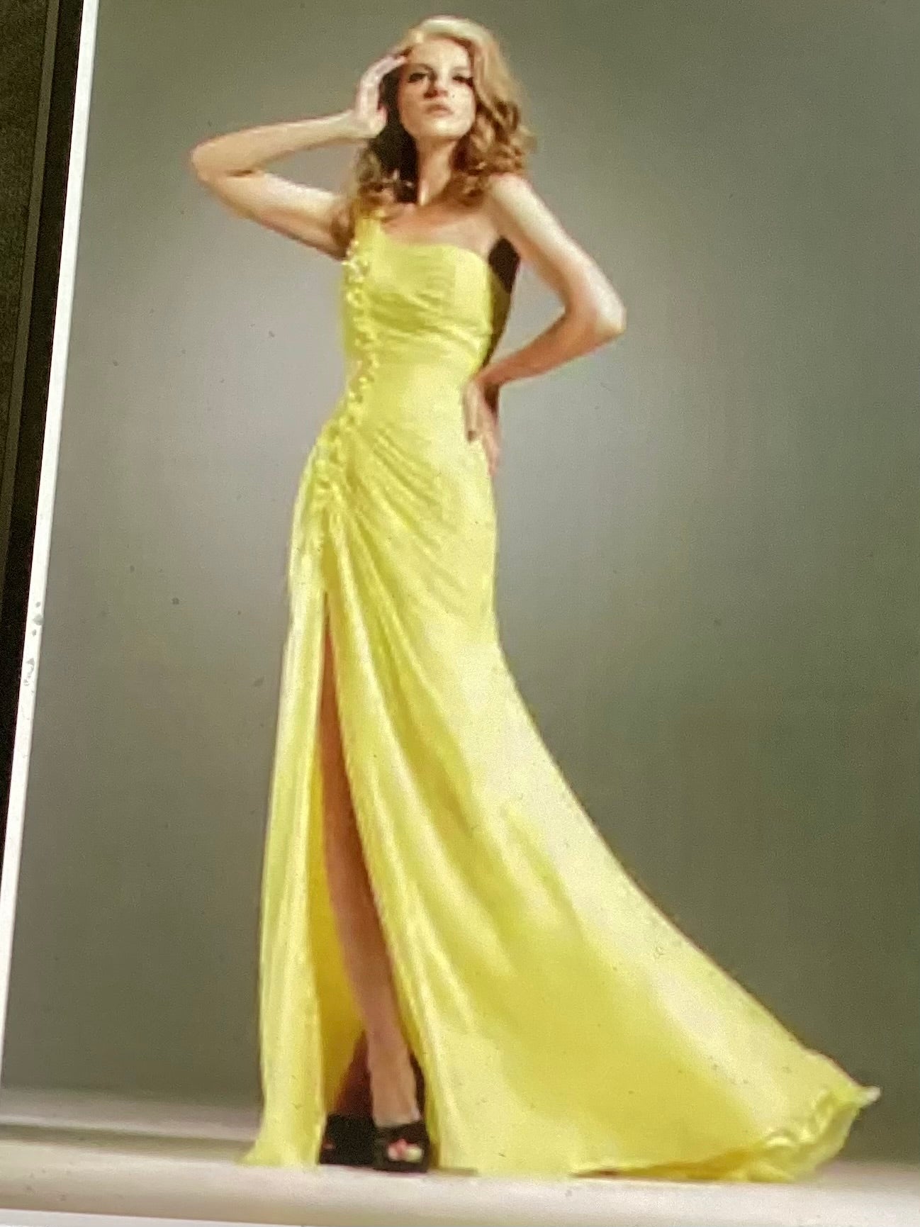 Woman’s yellow formal 1 shoulder neckline with front slit