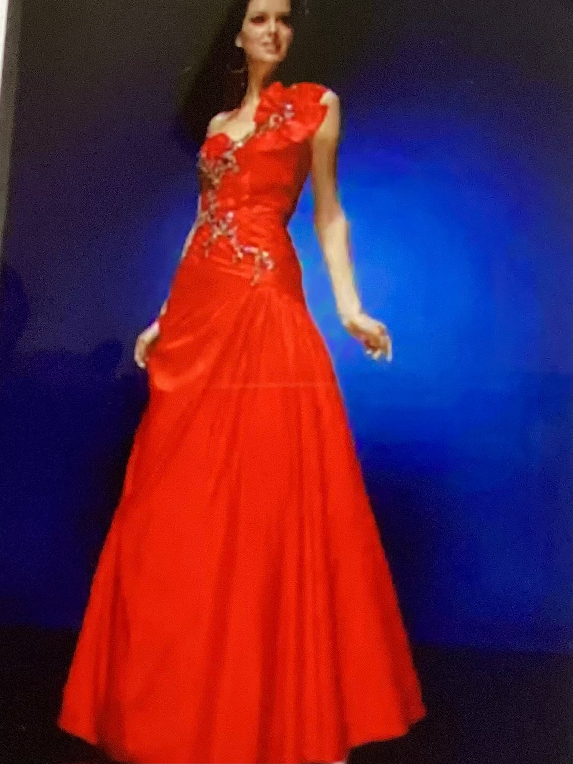 One shoulder red long formal with floral on shoulder and bling