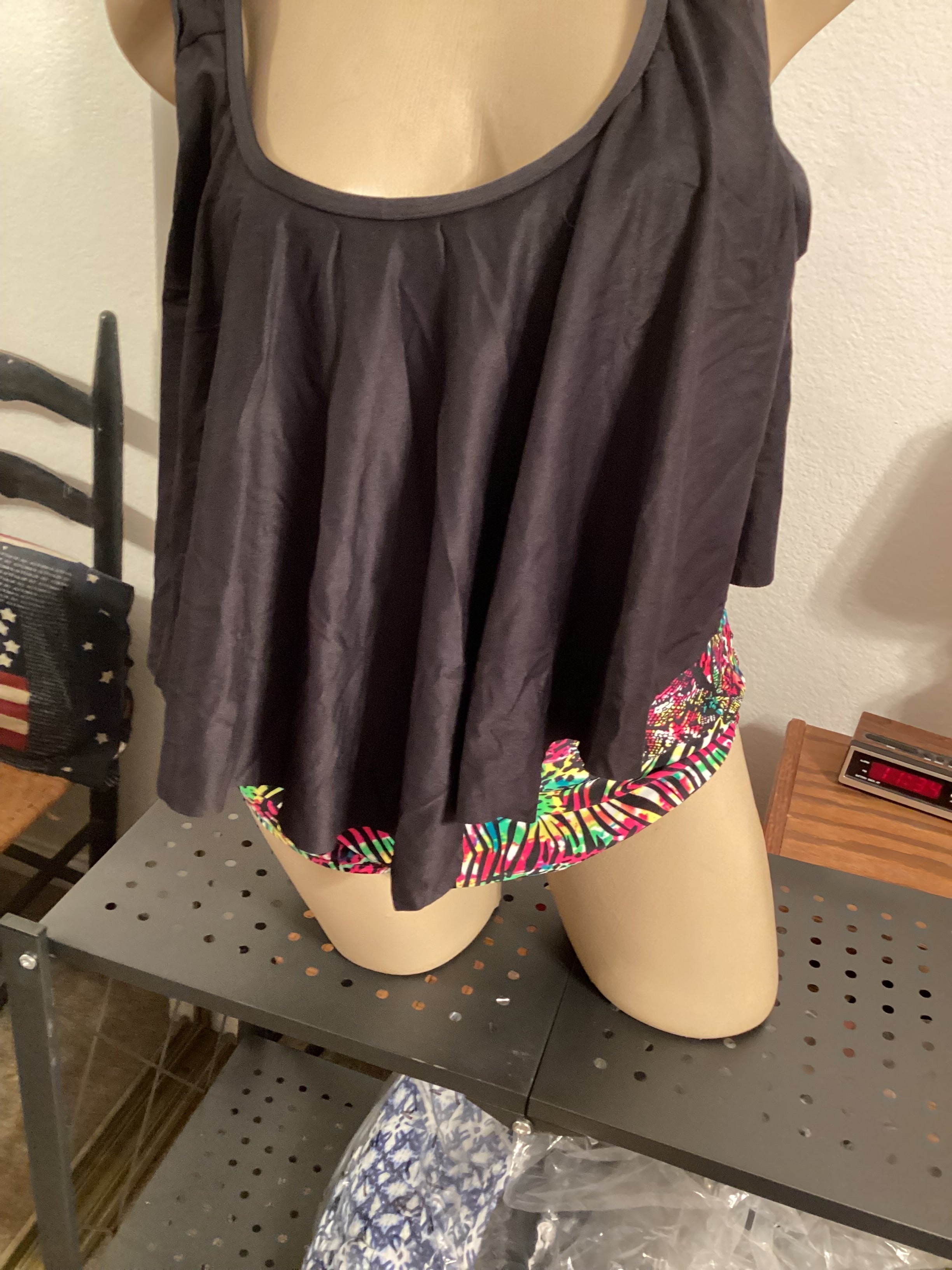 2 piece tankini swimsuit multicolored full coverage bottom with black top. Sizes s,m,l