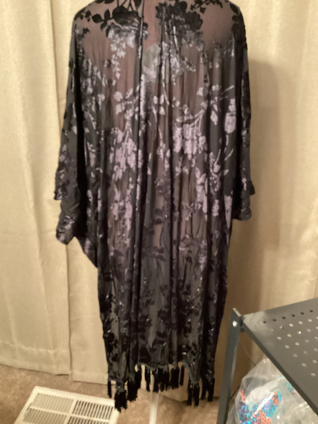 Umgee long black velvet cardigan with fringe on bottom. Sizes 1x,2x