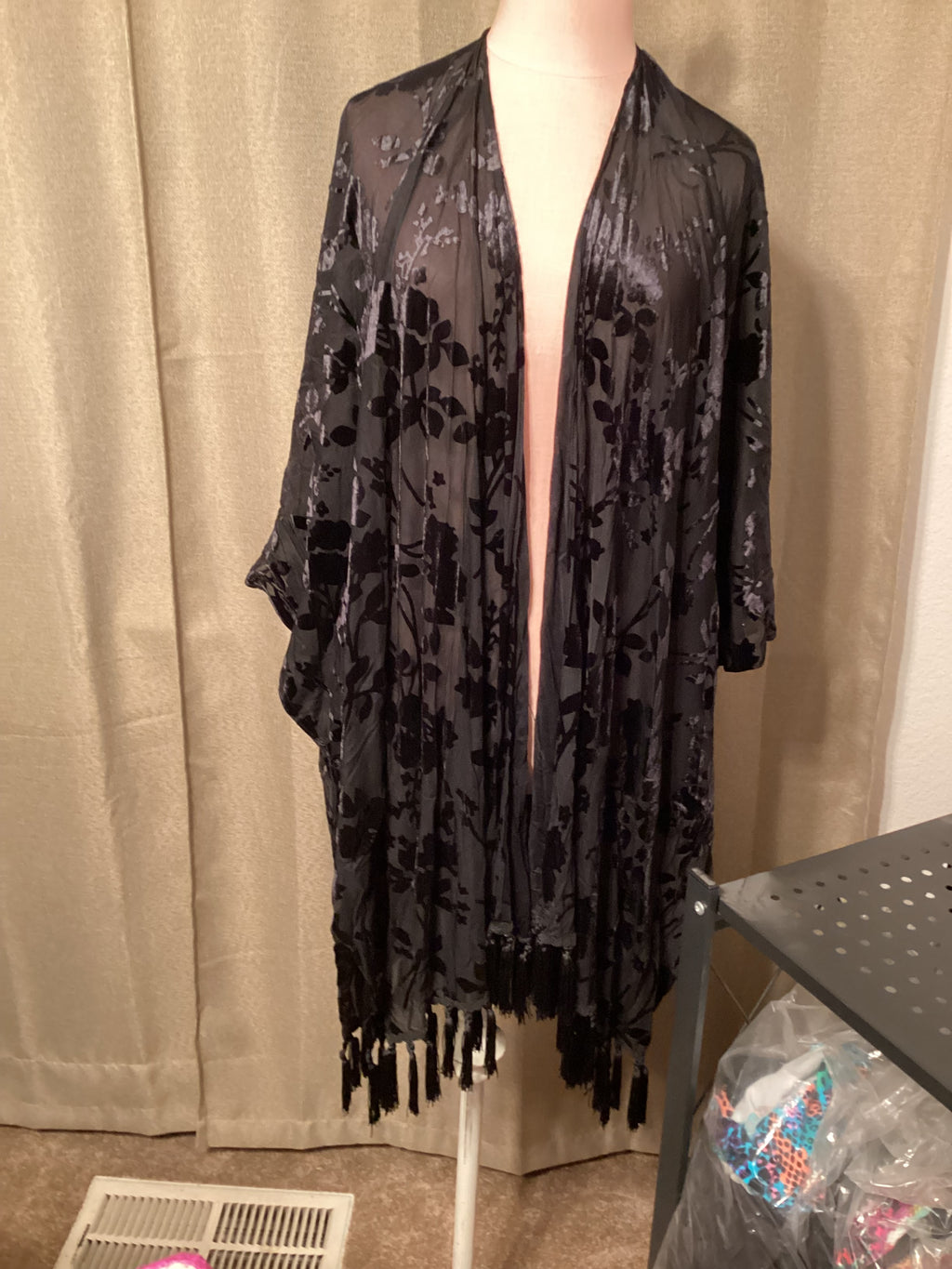 Umgee long black velvet cardigan with fringe on bottom. Sizes 1x,2x
