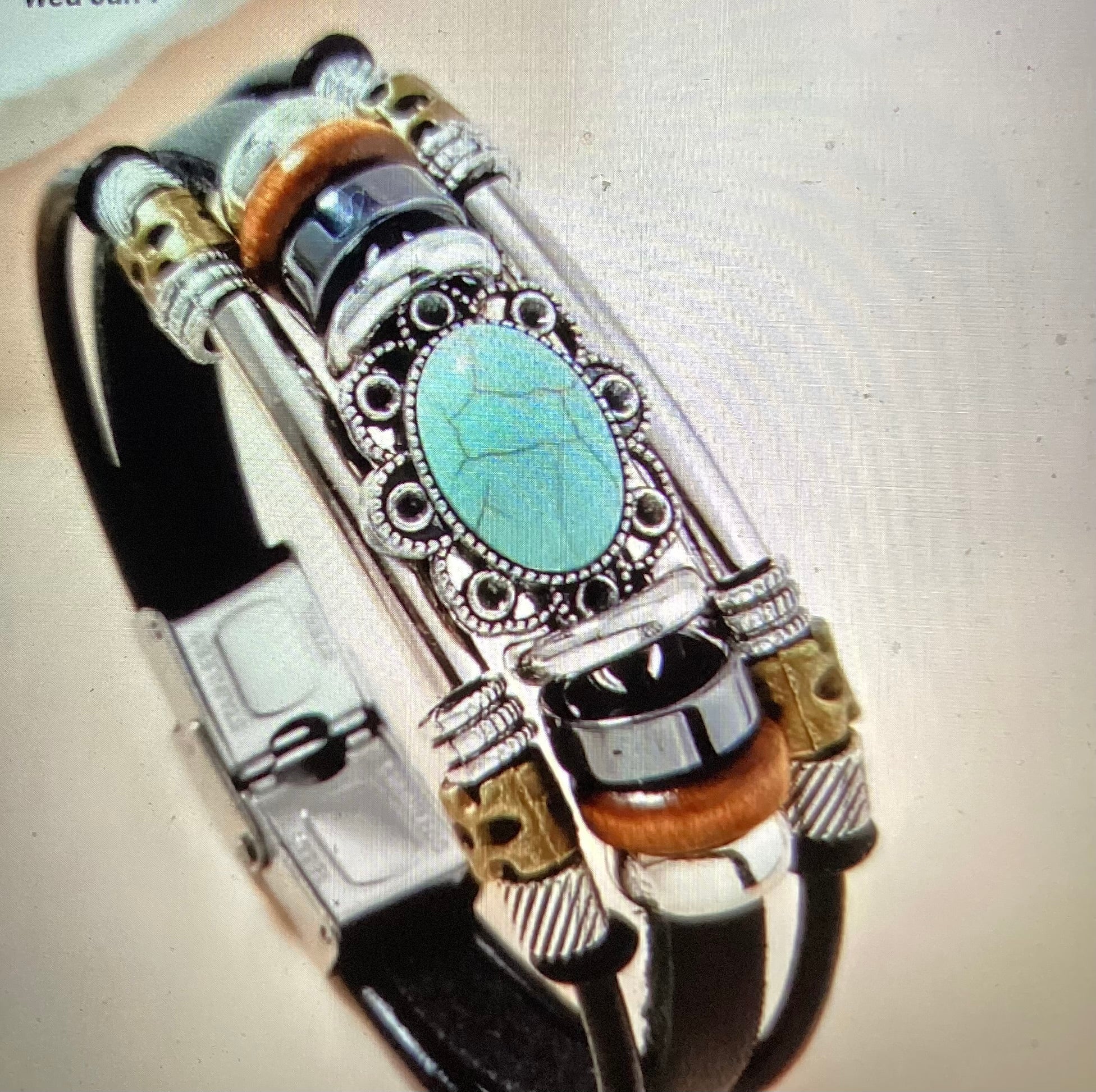 Black leather bracelet with oval shape turquoise