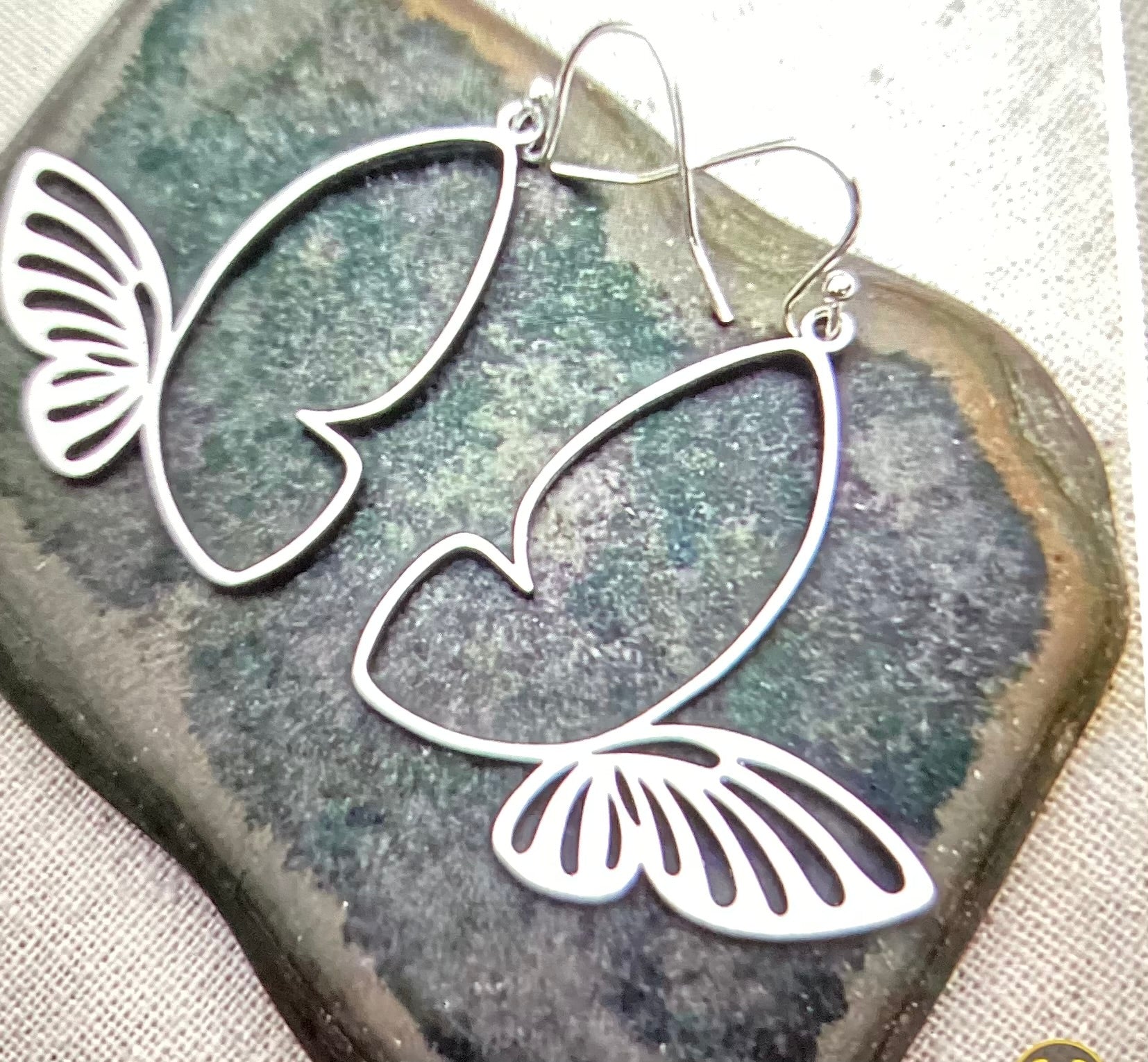 Silver butterfly with a folded wings