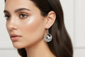 Round Dangling Earrings with a Horse Running Through the Field